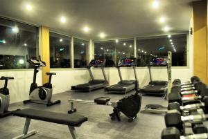 a gym with a bunch of exercise equipment in it at Ephesia Holiday Beach Club in Kuşadası