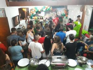 a group of people standing in a room at Chácara Recanto Suiço Piracicaba in Piracicaba