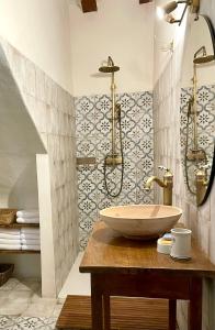 a bathroom with a sink and a shower at El Mirador de Benialfaqui, apartamento Els Olivers in Benialfaquí +46 photos