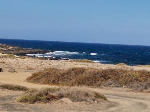 a beach with the ocean in the background at Casa Frasca in Teguise