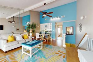 a living room with a couch and a table at Mapp to Paradise in Destin