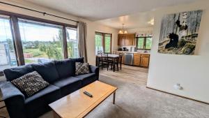 a living room with a couch and a table at Spacious Downtown 2-bdrm Apartment in Anchorage