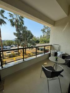 a balcony with a view of a parking lot at Apartamento Vista Jardim in São Domingos