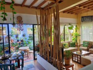 a living room with a couch and a table at House of Bela in Iloilo City
