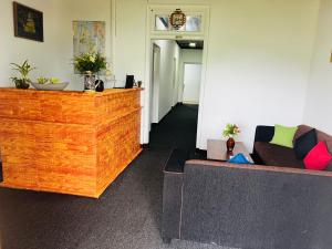 a living room with a couch and a table at Hillside cottage Nuwara Eliya in Nuwara Eliya