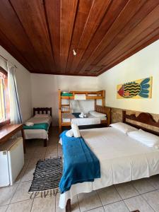 Postel nebo postele na pokoji v ubytování Pousada Brisamar Paraty COMECE O DIA COM UM CAFÉ DA MANHÃ INESQUECÍVEL