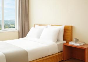 Postel nebo postele na pokoji v ubytování Hanwha Resort Gyeongju