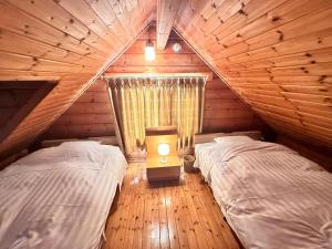 Postel nebo postele na pokoji v ubytování Niseko Izumikyo