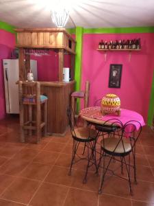 a kitchen with a table with a cake on it at AranCalli, hospedaje en cabañas in Ozumba de Alzate