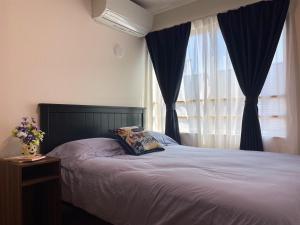 Postel nebo postele na pokoji v ubytování SKYE HOMEⅡ本羽田
