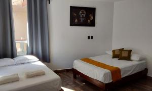 Postel nebo postele na pokoji v ubytování Villas Carlota Cancún