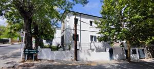 a white building with a no parking sign in front of it at La Casita de Lauri in El Escorial