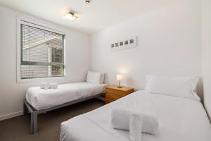 Ένα ή περισσότερα κρεβάτια σε δωμάτιο στο Belvedere Brook Apartment
