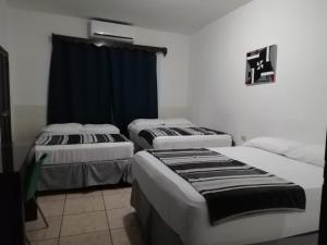 Postel nebo postele na pokoji v ubytování Apart Hotel Express