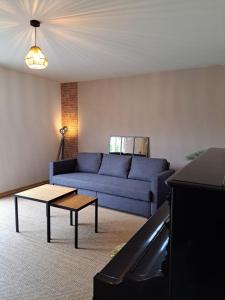 Chambre dans maison en colocation的休息区