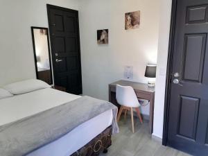 Postel nebo postele na pokoji v ubytování Apart Hotel Express