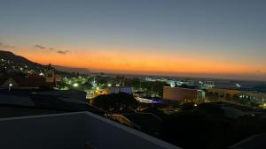 a view of a city at night at Amiri in Puerto Colombia +8 photos
