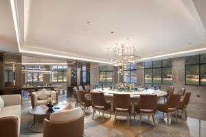 Posezení v ubytování Home2 by Hilton Chongqing Wushan