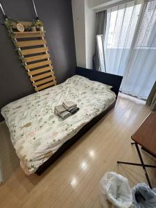 Кровать или кровати в номере 渋谷道玄坂401