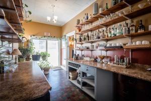 a large kitchen with a counter with lots of shelves at Lakelawn B&B and Motel in Yarmouth