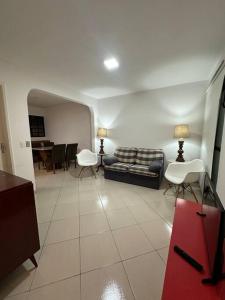 a living room with a couch and chairs and a table at Casa Vl Mariana-Próx SP Expo-com garagem in Sao Paulo