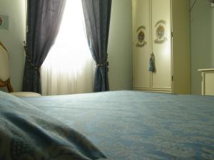 Postel nebo postele na pokoji v ubytování Residence Meuble' Cortina