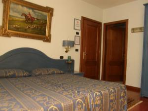 Postel nebo postele na pokoji v ubytování Residence Meuble' Cortina
