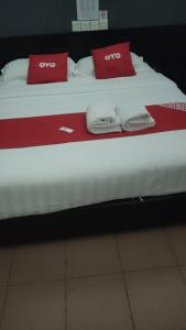 Postel nebo postele na pokoji v ubytování Dung Fang Hotel No 1 Sibu