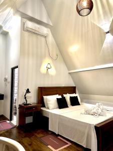 Letto o letti in una camera di Rustic Cottages Udawalawe