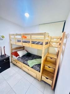 a bunk bed room with two bunk beds at Mariscal uno zona 11 in Guatemala