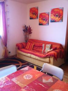 a room with a bed in the corner of a room at Torre Dell'orologio Apartment in Sestriere