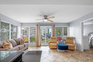a living room with a couch and chairs at Plantation West Condos in Gulf Highlands +88 photos