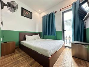 Postel nebo postele na pokoji v ubytování Nineties homestay