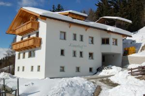 a building in the snow with snow around it at Kaserhof in Bressanone