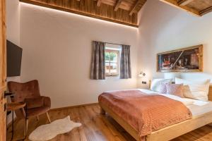 Ένα ή περισσότερα κρεβάτια σε δωμάτιο στο Almchalet Weberhof