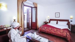 Voodi või voodid majutusasutuse Hotel Il Querceto toas