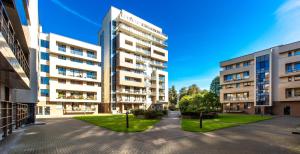 an apartment building in the middle of a street at DRUSKININKŲ PANORAMA Apartamentai in Druskininkai +8 photos