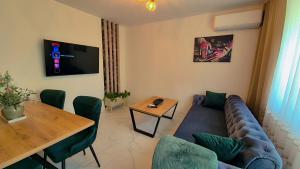 a living room with a couch and a table at Noor Lux Apartments in Bad Hall