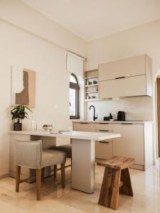 A kitchen or kitchenette at Ariadne Suites