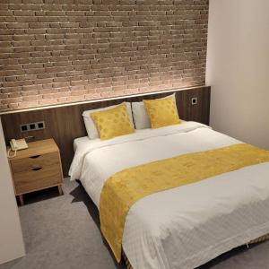 Voodi või voodid majutusasutuse 雅莊旅館 toas
