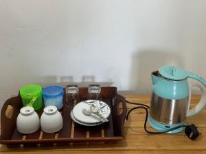 Příslušenství pro přípravu čaje a kávy v ubytování Felicity Inn