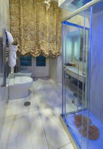 a bathroom with a shower and a toilet and a sink at B&B Roma Royal Residence in Rome +119 photos