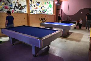 two pool tables in a gym with people playing at Fun & Relax Park Thurnau in Thurnau