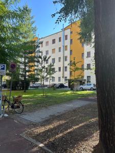 a bike parked on a sidewalk next to a building at Ripalta House in San Donato Milanese