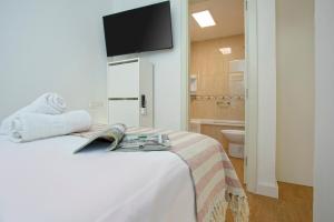 Ένα ή περισσότερα κρεβάτια σε δωμάτιο στο Sunstay Center Flat I Arroyo De La Miel