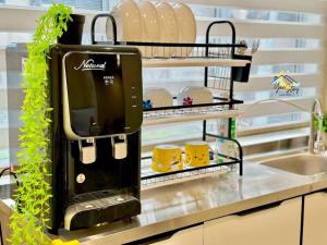 Η κουζίνα ή μικρή κουζίνα στο Kota10pax PoolTable Karaoke