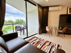 Posezení v ubytování Escape Condominiums Beachfront Suites - Mae Phim