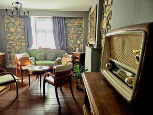 a living room with a couch and a table at Feel at home in Warre, Durbuy in Durbuy