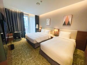 Hotel Skypark Central Seoul Pangyo房間的床