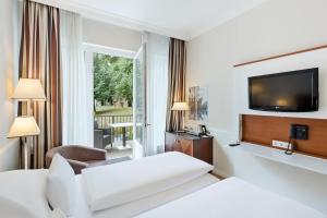 Кровать или кровати в номере Austria Trend Parkhotel Schönbrunn Wien